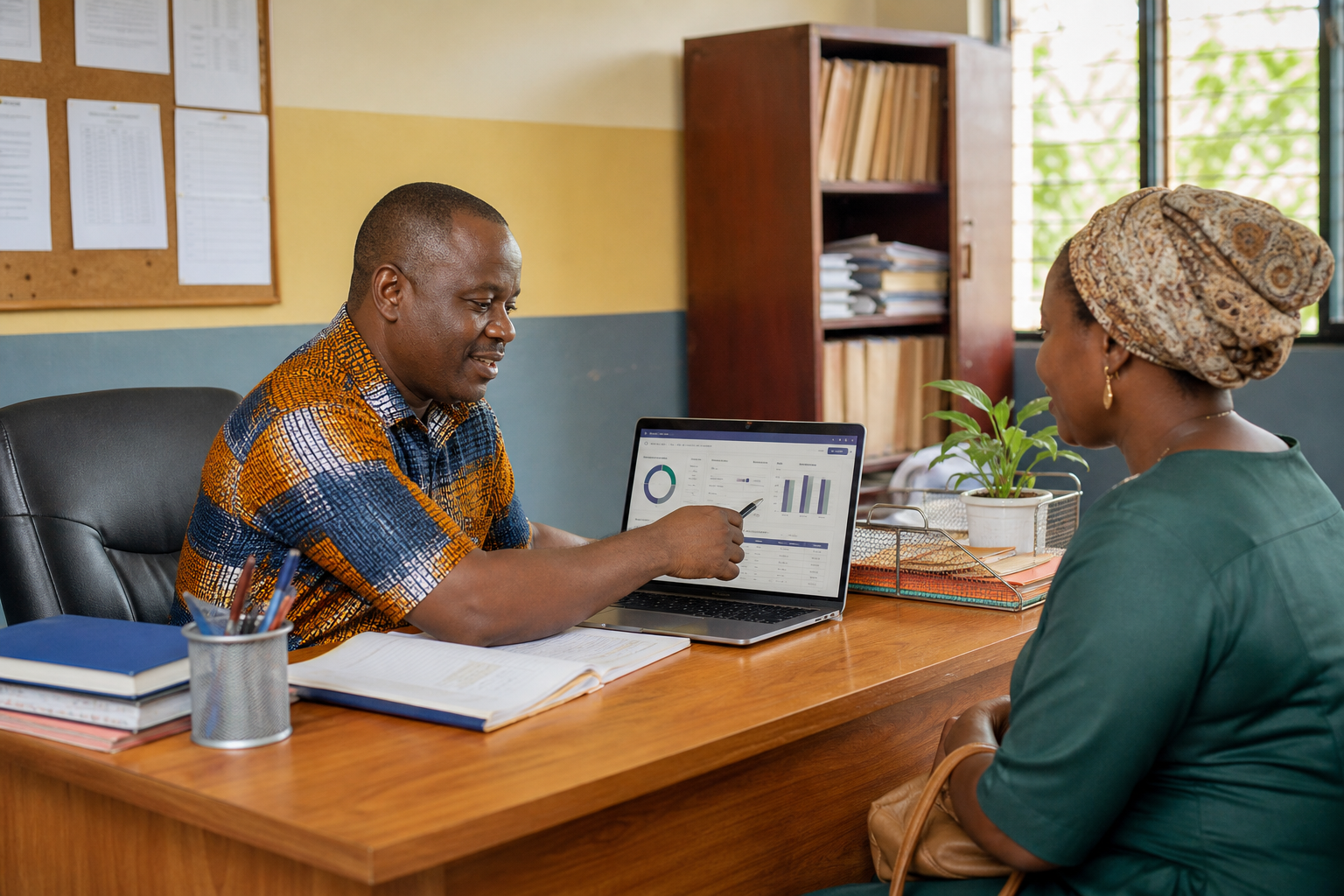 Ghanaian school administrator reviewing fees with a parent